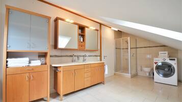 Shower, towels, soap, toilet paper