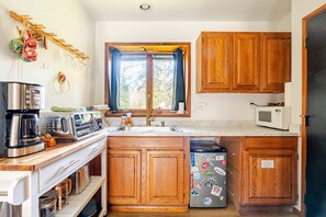 Microwave, toaster, cookware/dishes/utensils, spices