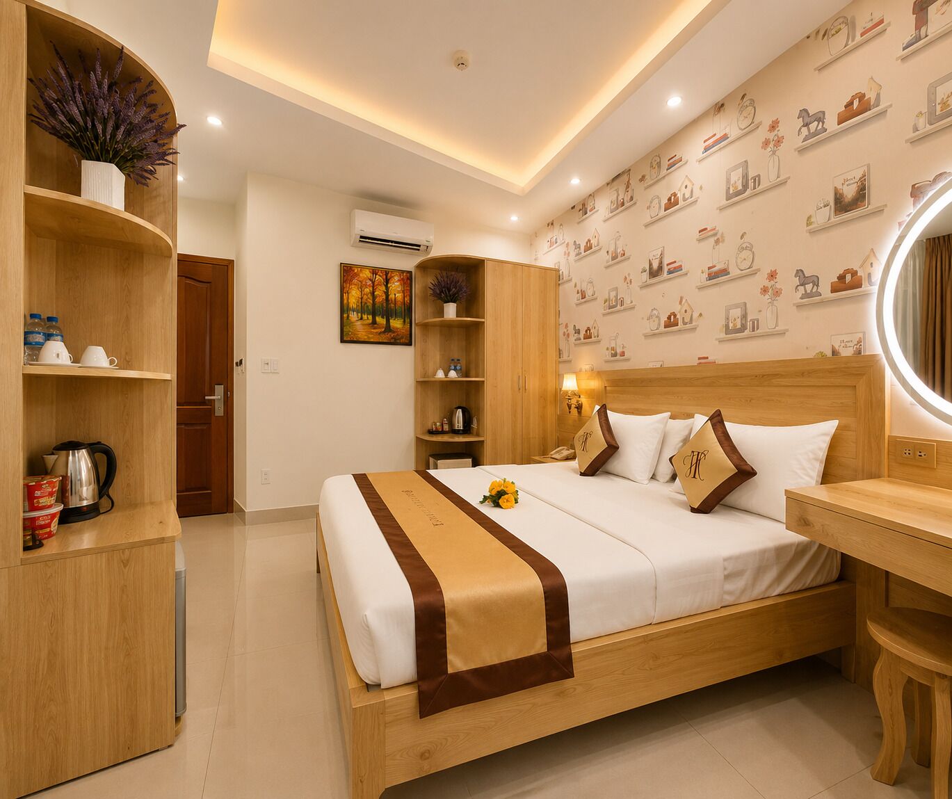 A hotel room with a bed, bedside table, and a wooden wardrobe.
