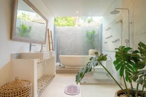 Shower, bathrobes, slippers, towels