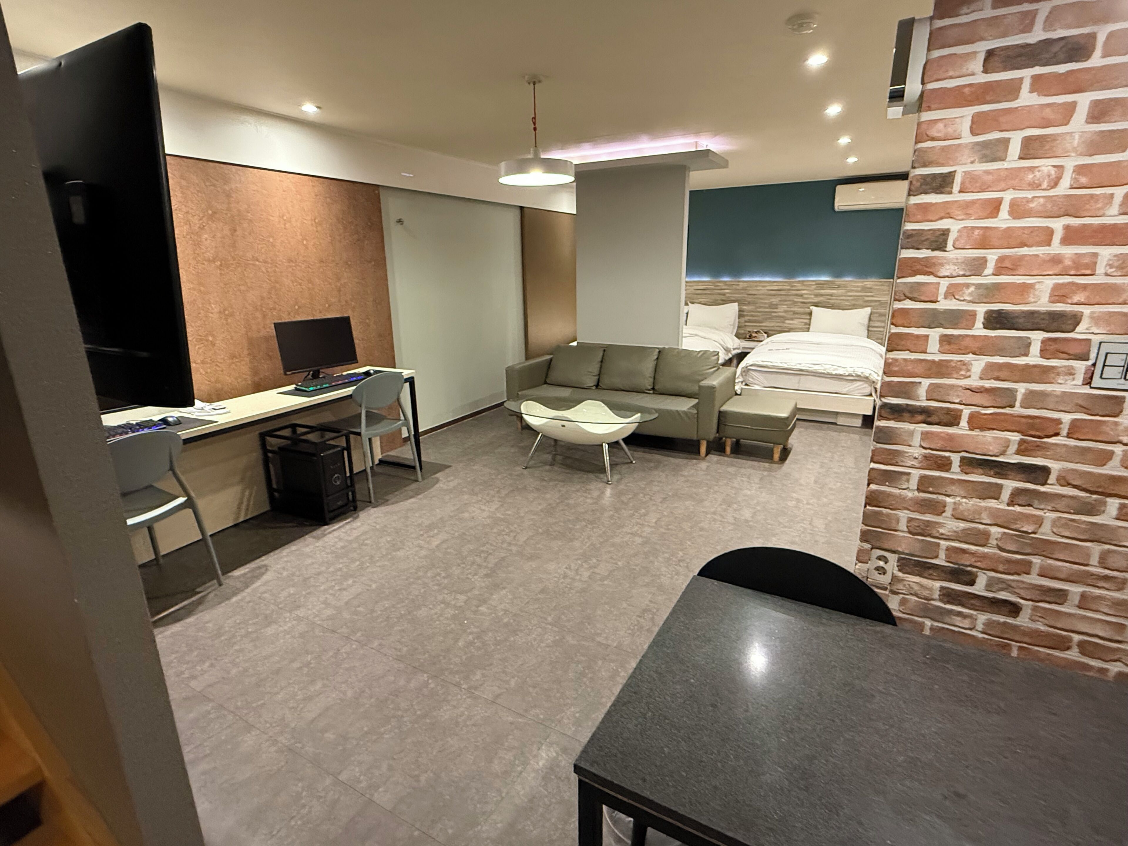 Deluxe Quadruple Room, City View | Down comforters, desk, laptop workspace, free WiFi