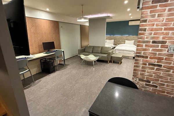 Deluxe Quadruple Room, City View | Down comforters, desk, laptop workspace, free WiFi