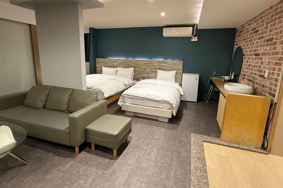 Deluxe Quadruple Room, City View | Desk, laptop workspace, free wired internet