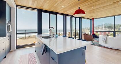 Modern oceanfront container home with electric fireplace & wifi - walk to beach