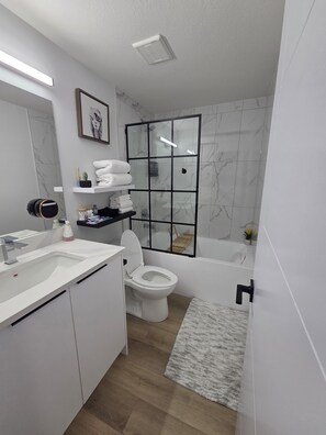 Shower, eco-friendly toiletries, hair dryer, towels