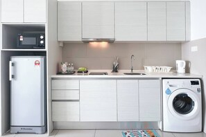 Fridge, microwave, cookware/dishes/utensils