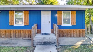 A single-story house with a blue exterior, a white door, and wooden shutters. - 7 Mi to Lake Tangipahoa: McComb Home w/ Deck! (McComb)