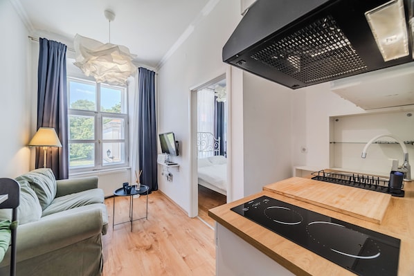 Family Apartment, 1 Bedroom (Old Town Heritage Suite 2) | Living room | 32-inch Smart TV with digital channels