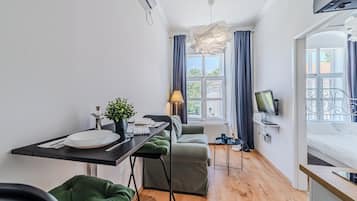 Family Apartment, 1 Bedroom (Old Town Heritage Suite 2) | Living room | 32-inch Smart TV with digital channels