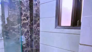 Shower, designer toiletries, hair dryer, bathrobes