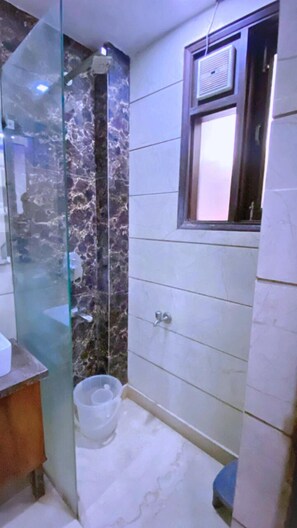 Shower, designer toiletries, hair dryer, bathrobes