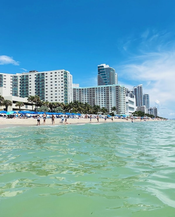 On the beach, sun loungers, beach towels