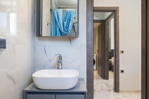 Shower, hair dryer, towels, soap