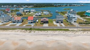 A coastal residential area with houses, a road, and a beach. - Waterfront Paradise in N. Topsail: Ocean/Canal Views, Fishing, Steps from Beach (North Topsail Beach)