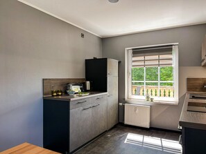 Appartement | Cuisine privée | Chaise haute
