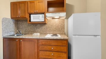 Fridge, microwave, stovetop, cookware/dishes/utensils