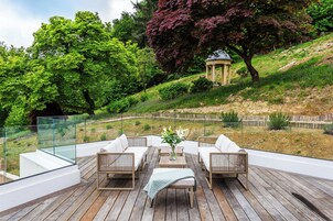 Luxury Suite, Garden View | Desk, laptop workspace, iron/ironing board, free WiFi