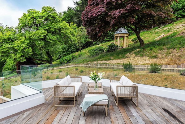 Luxury Suite, Garden View | Desk, laptop workspace, iron/ironing board, free WiFi
