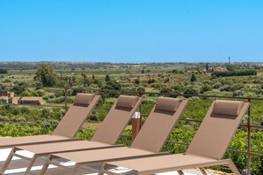 Seasonal outdoor pool, pool loungers