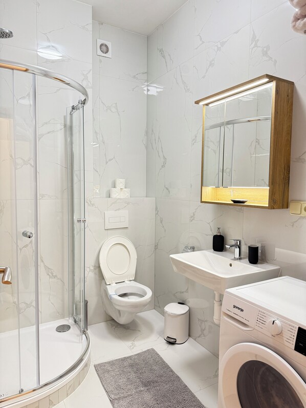 Shower, hair dryer, towels, soap