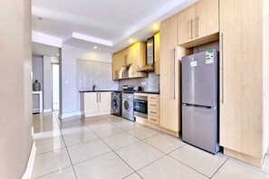 Full-size fridge - Glammys Suites at Hydro (Sandton)