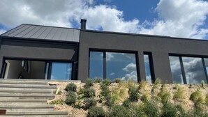 A modern building with large windows and a flat roof. - Amazing villa with swimming pool next to the lake. (Wrzeszewo)