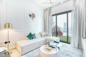 Luxury Apartment | Living room | 55-inch Smart TV with digital channels - PVH - Exquisite 1BR - Binghatti Canal (Dubai)