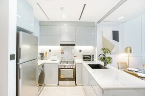 Luxury Apartment | Private kitchen | Full-size fridge, microwave, oven, stovetop