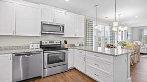 Fridge, microwave, dishwasher, coffee/tea maker - 5115 The Retreat - Barefoot Resort Rentals (North Myrtle Beach)