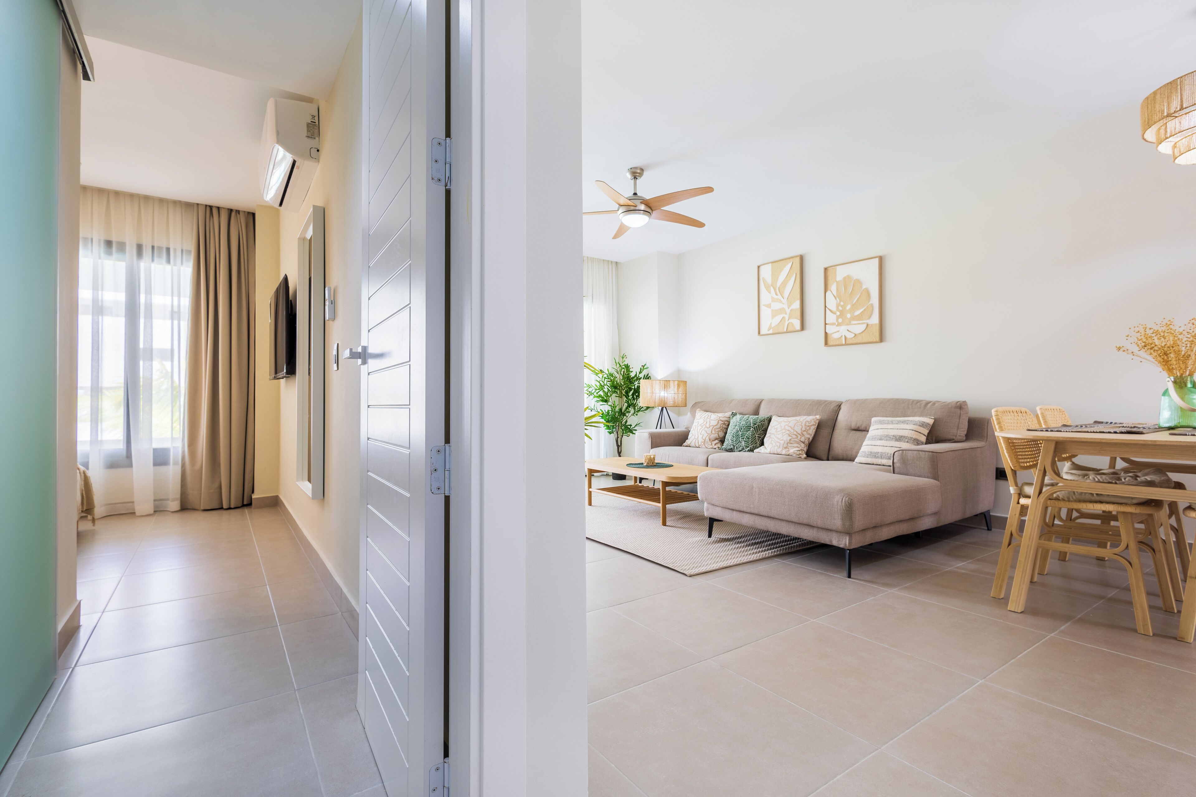 Deluxe Condo | Living area | 55-inch Smart TV with digital channels