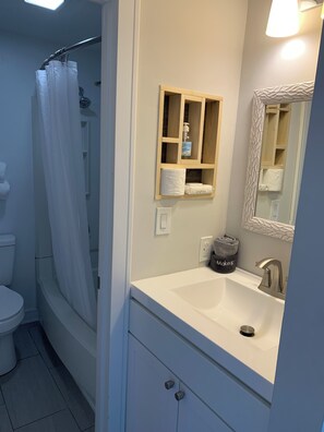 Hair dryer, towels, soap, toilet paper