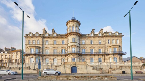 A historic building with a central tower, multiple windows, and a prominent entrance. - Host Stay 18 The Zetland (Saltburn-by-the-Sea)