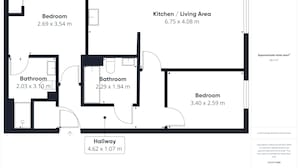 Plan d’étage d’un hôtel d’une superficie totale de 66,4 m², comprenant un couloir, deux salles de bain, deux chambres et une cuisine/salon.