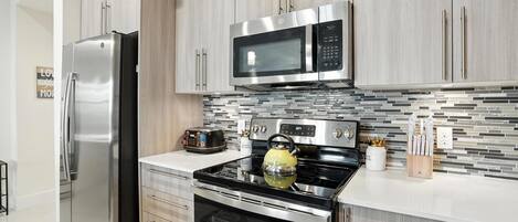 Coffee/tea maker, fridge, microwave, oven