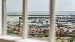 A coastal town with a marina, historic buildings, and a lighthouse. - Host & Stay | Albion Place (Ramsgate)