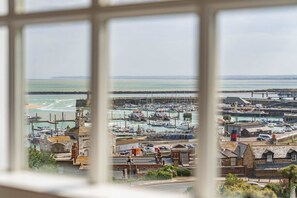 A coastal town with a marina, historic buildings, and a lighthouse. - Host & Stay | Albion Place (Ramsgate)
