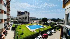 A residential building with a swimming pool, a tennis court, and a parking area. - Apartamento Faro Torrox by At Home Costa del Sol (Torrox)