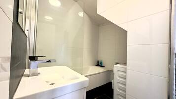 Bidet, towels, soap, toilet paper
