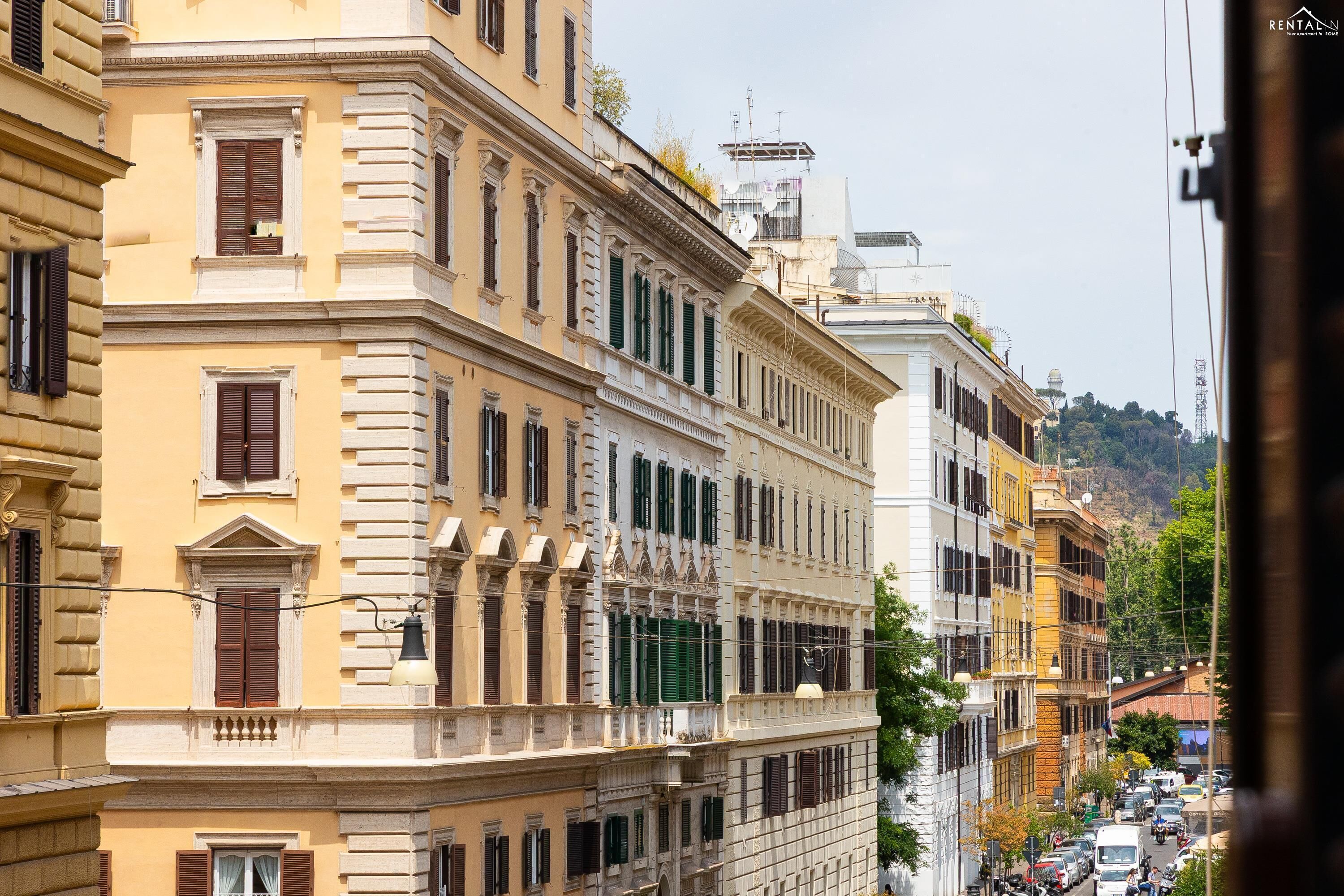 A row of historic buildings with classic architecture, featuring multiple stories and uniform window designs.