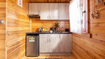 Fridge, stovetop, highchair, dining tables