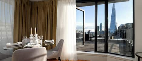 Luxury Penthouse, Balcony, City View | Living area | 42-inch Smart TV with digital channels