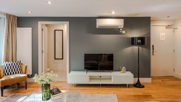 Deluxe Apartment, Balcony, City View | Living area | 42-inch Smart TV with digital channels