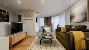 Luxury Penthouse, Balcony, City View | Living area | 42-inch Smart TV with digital channels