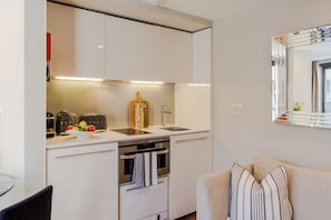 Monolocale Exclusive, balcone, vista città | Cucina privata