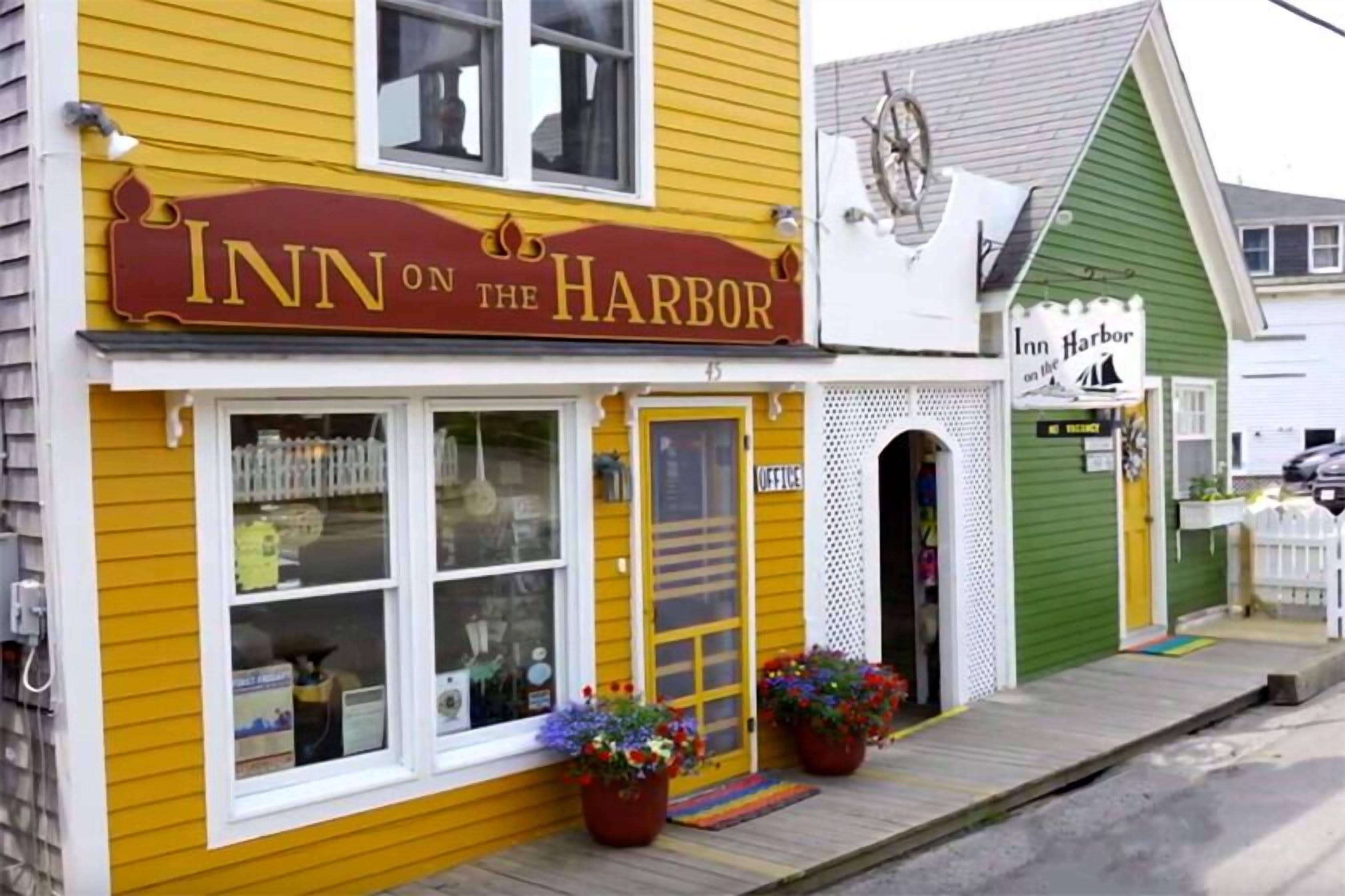 A yellow building with a sign reading "Inn on the Harbor."