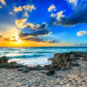 A beach with rocky formations and waves. - 4br/2ba Zen Garden mins to adventures (Stuart)