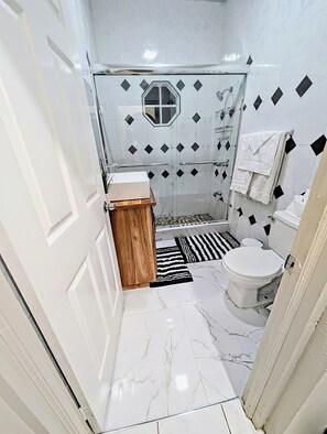 Shower, hair dryer, towels, soap
