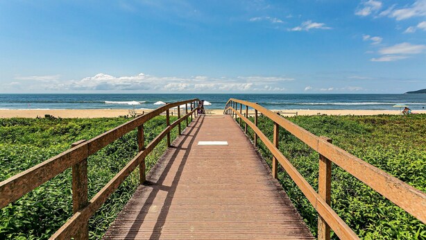 A wooden boardwalk leading to a beach with a clear sky. - Charming apt w/ Balcony 150m From the Beach Abc0403 (Itajai)