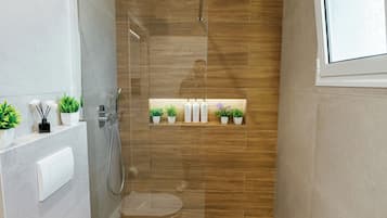 Shower, hair dryer, towels, soap