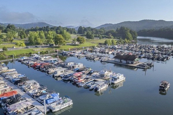 Colorful boats line the marina, promising easy access to lake adventures and leisurely moments on the water.